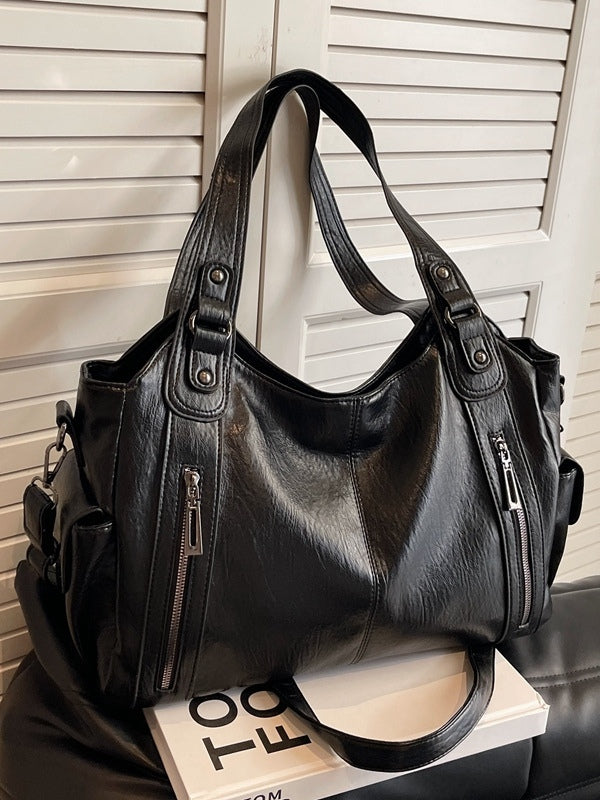 Borsa tote alla moda con rivetti di alta gamma e grande capacità